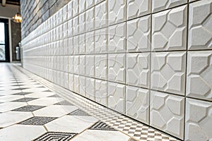 White concrete tile wall with square mosaic pattern