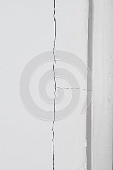 White concrete wall with cracked