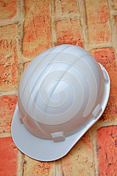 Hart hat on wall background