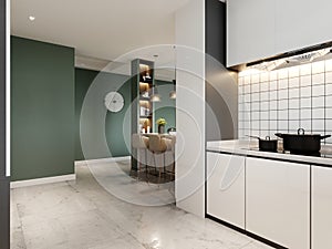 A white contemporary kitchen with glossy paneling and green and white walls with a wine rack and built-in appliances