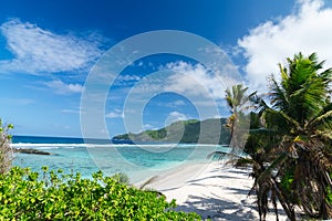 White coral beach sand and azure indian ocean.