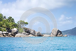 White coral sand on tropical beach. La Digue island, Seyshelles. photo