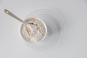 White  cosmetic clay  powders on white background. Flat lay