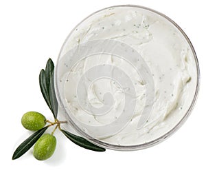 White cosmetic cream with green olives