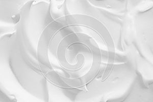 White cosmetic foam texture background. Thick mousse, cleanser, shaving foam, shampoo lather