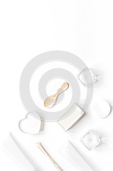 white cosmetic set on desk background top view mock up