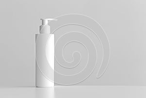 White cosmetic shampoo dispenser bottle mockup with blank copy space on a white table