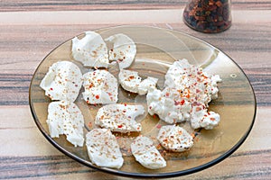 White cottage cheese and mozzarella served with spices
