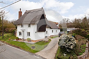 17th century white thatched cottage