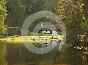 White Cottage on Lake, Scotland photo