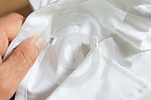 A white cotton shirt with size XXL