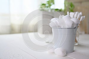 White cotton swabs cotton bud and cotton ball on background