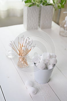 White cotton swabs cotton bud and cotton ball on background
