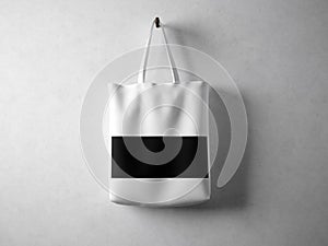White cotton textile bag with black line in center holding, neutral background. Horizontal 3d render