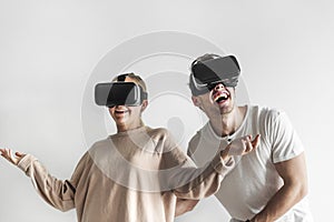 White couple experiencing virtual reality with VR headset photo