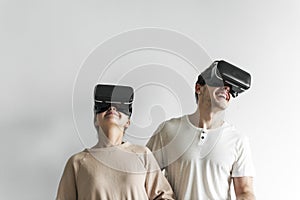 White couple experiencing virtual reality with VR headset photo