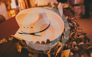 White Cowboy hat on leaves