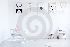 White cradle in baby`s bedroom