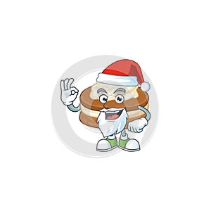 White cream alfajor cartoon character of Santa showing ok finger