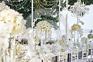 The white cream roses, orchids decoration on the reception dinner table, flowers, Floral - closed up