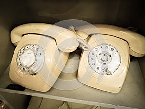 White cream Vintage Rotary desk Telephone in Aged tone photo.