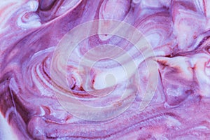White creame yoghurt, ice cream mixing with violet blueberry taste. Texture background photo