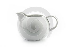 A white creamer on a white background, isolated