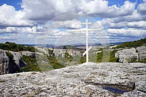 White cross and clouds