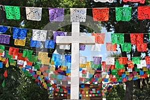 White cross with colorful flags, Mexico