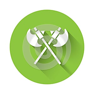 White Crossed medieval axes icon isolated with long shadow. Battle axe, executioner axe. Medieval weapon. Green circle