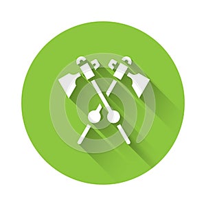 White Crossed medieval axes icon isolated with long shadow. Battle axe, executioner axe. Medieval weapon. Green circle