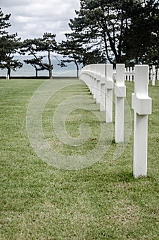 White crosses in American Cemetery, Coleville-sur-Mer, Omaha Beach, Normandy, France. photo