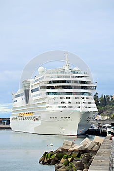 White cruise liner at anchor in the harbor