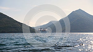 White cruise liner in the Bay of Kotor. Sunny day in Montenegro.