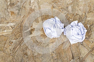 White Crumple paper ball on old wood table