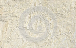 White crumpled paper background with a pronounced texture.