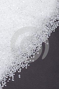 White crystals sea salt on darck background
