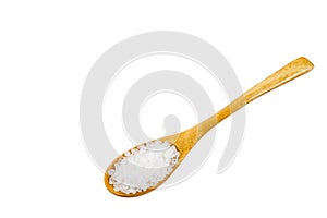 White crystals sea salt on wooden spoon on white background