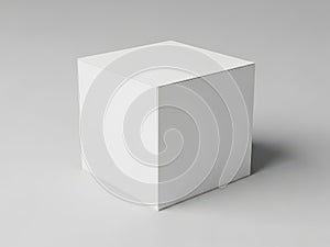 A white cube on a plain gray background with subtle shadow effect