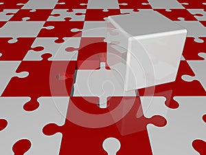 White cube on puzzle pieces