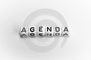 White cubes with word AGENDA on white background