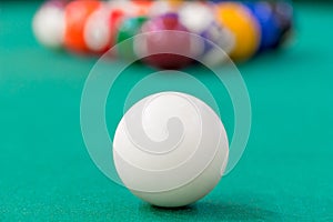 White cue ball on green cloth