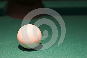 White cue ball on pool table photo