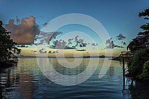 White Cumulostratus or Cumulus clouds over a lagoon on Samoa