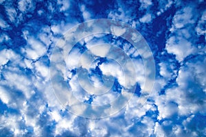 White cumulus clouds against the blue sky