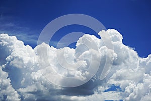 White cumulus clouds. Azure, light blue sky. Background. Summer sunny day.