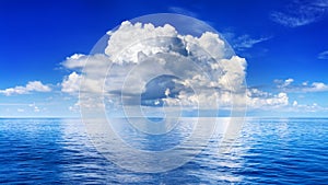 White cumulus clouds in blue sky over sea landscape, big cloud above ocean water panorama, horizon, beautiful tropical seascape