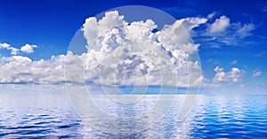 White cumulus clouds in blue sky over sea landscape, big cloud above ocean water panorama, seascape panoramic view, cloudy weather