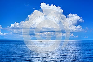 White cumulus clouds in blue sky over sea landscape, big cloud above ocean water panorama, seascape panoramic view, cloudy weather