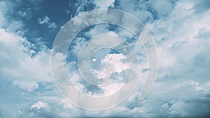 White cumulus clouds in the blue sky before the rain on a summer day